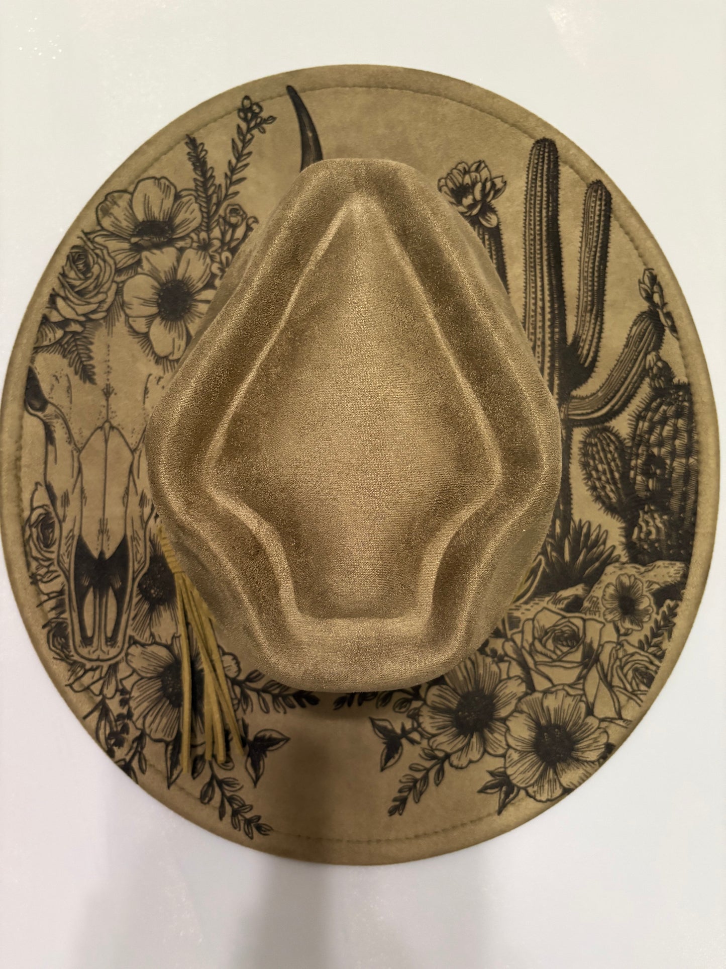 Western skull and cactus laser engraved hat.